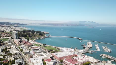 Aerial-panoramic-view-of-Fisherman's-Wharf-with-Golden-Gate-Bridge-in-background