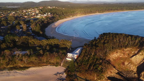 Revealing-drone-shot-of-Scotts-Head-beach-and-town-in-Australia