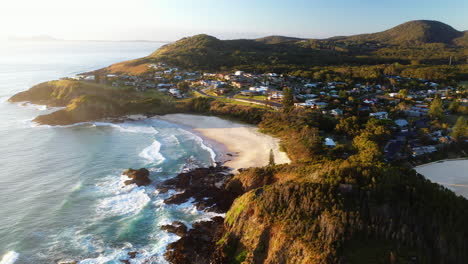 Cinematic-lowering-drone-shot-of-Scotts-Head-beach-and-town-in-Australia