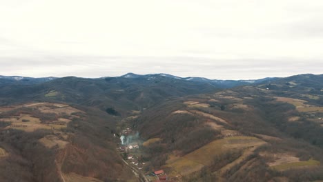 Autumn-landscape-of-the-village-in-the-valley,-Drone-4K-colored