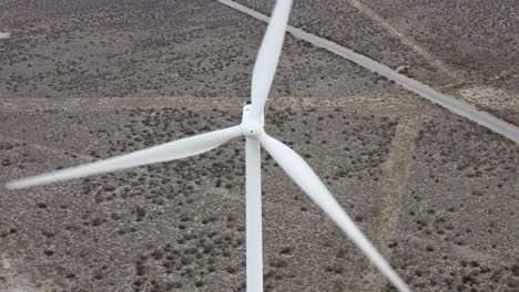 Wind-turbine,-alternative-clean-energy,-aerial-above-view,-landscape-later-in-day