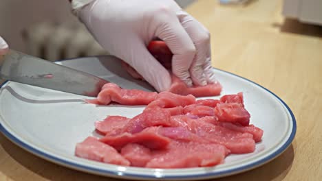 Raw-meat-is-cut-into-long-strips