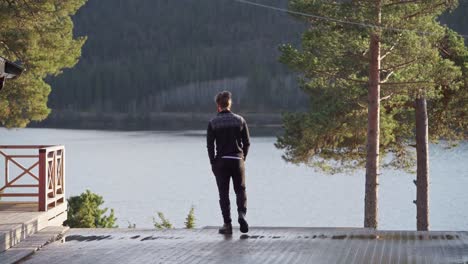 Man-Standing-On-The-Lakeside-Platform-In-Norway