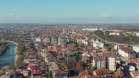 Kraljevo-city-and-Ibar-river-in-Serbia,-Balkan-urban-architecture,-aerial