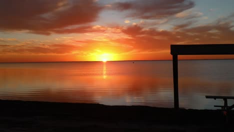 Magnificent-sunset-over-a-calm-Laguna-Madres-estuary-at-North-Padre-Island-National-Seashore-along-Gulf-Coast-of-Texas