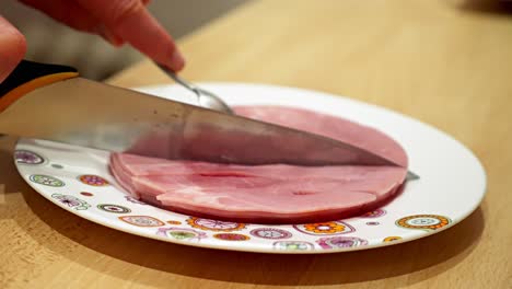 Cooked-ham-is-cut-into-small-pieces