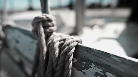 Old-Weathered-Rope-And-Peeled-Paint-Of-An-Old-Boat---close-up