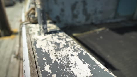 Aged-Paint---Wooden-Old-Boat-Peeling-Texture-Surface---tracking-shot,-slow-motion