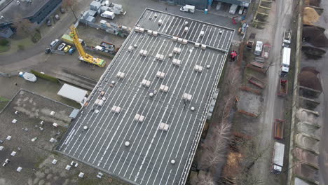 Aerial-of-construction-workers-walking-on-rooftop