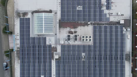 Top-down-jib-up-of-solar-panels-on-industrial-building