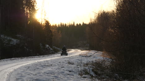 Little-Kid-Rides-Quad-Bike-alone-on-rural-winter-road