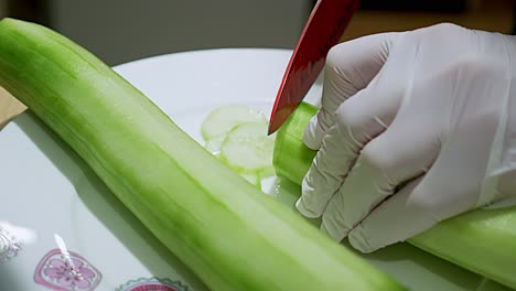 A-peeled-green-cucumber-that-is-sliced-with-a-whole-one-next-to-it