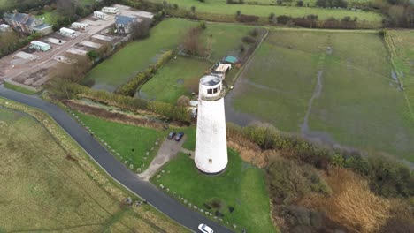 Historic-Leasowe-Lighthouse-maritime-beacon-landmark-aerial-coastal-countryside-Wirral-view-rising-birdseye