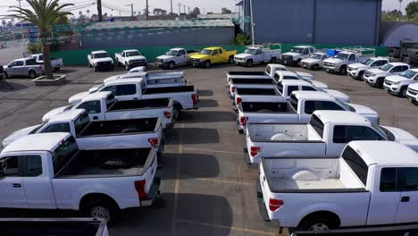 Aerial-flyover-shot-of-a-used-truck-automotive-lot