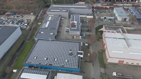 Stunning-aerial-of-industrial-rooftops-filled-with-solar-panels
