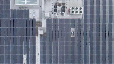 Top-down-jib-down-of-solar-panels-on-industrial-building