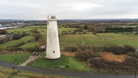Historic-Leasowe-Lighthouse-maritime-beacon-landmark-aerial-coastal-countryside-Wirral-mid-orbit-right-view