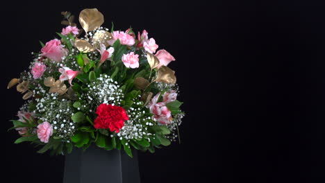 Carnation-bouquet-arrangement-spinning-and-slider-in-black-background