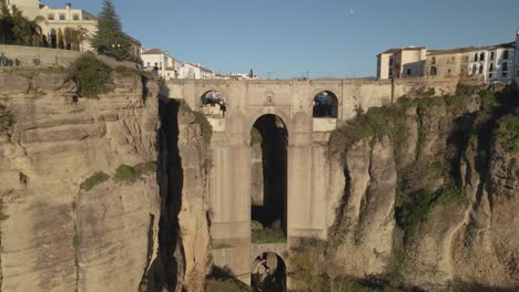 Moving-backwards-fast-from-Puente-Nuevo-bridge,-revealing-the-town-of-Ronda,-Andalusia,-Spain