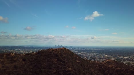 Aerial-shot-flying-over-Hollywood-hill-to-reveal-Downtown-Los-Angeles