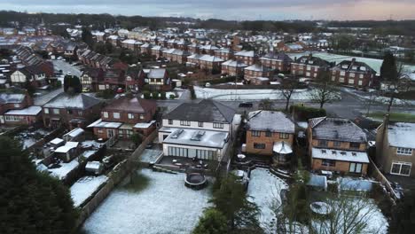 Snowy-aerial-village-residential-neighbourhood-Winter-frozen-North-West-houses-and-roads-left-dolly