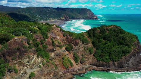 Beautiful-Pristine-Waves-Of-Whites-And-Piha-Beaches-In-Auckland,-New-Zealand-On-A-Sunny-Summer-Day---aerial-drone,-slow-motion