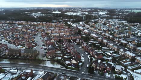 Snowy-aerial-village-residential-neighbourhood-Winter-frozen-North-West-houses-and-roads-follow-left-dolly