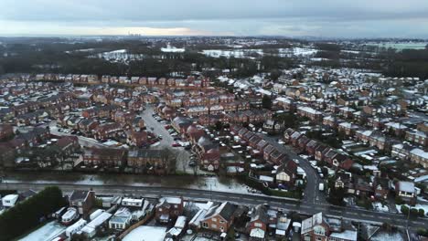Snowy-aerial-village-residential-neighbourhood-Winter-frozen-North-West-houses-and-roads-slow-descend