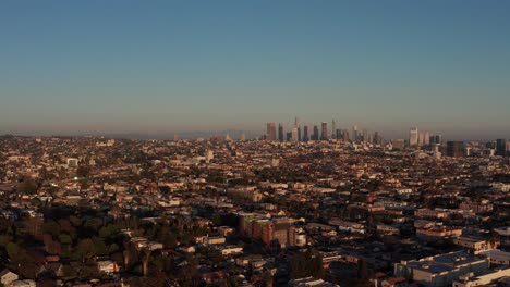 Aerial-panning-shot-of-Downtown-Los-Angeles-from-Hollywood-during-sunset