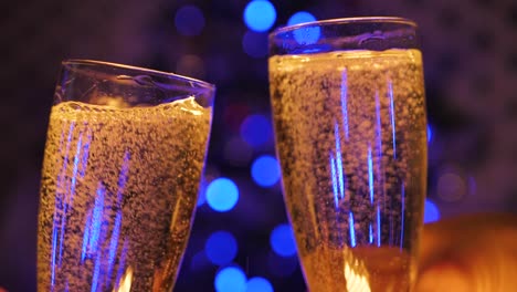 People-clink-glasses-of-champagne-and-celebrate-the-New-Year-2021