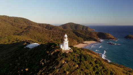 Cinematic-drone-shot-rotating-around-Smoky-Cape-Lighthouse-in-Australia