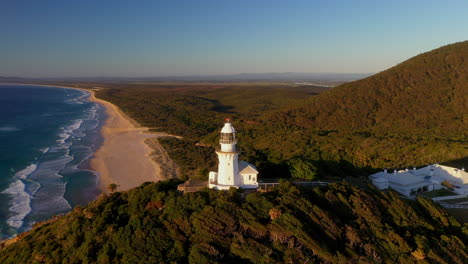 Cinematic-drone-shot-rotating-around-Smoky-Cape-Lighthouse-in-Australia-revealing-pacific-ocean