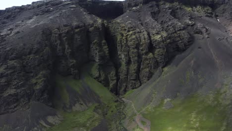 Mythical-ravine-in-middle-of-steep-basalt-cliffs-in-Iceland,-Raudfeldsgja