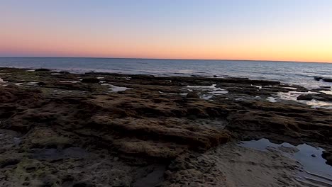Pan-across-tide-pools-at-sunset,-Puerto-Peñasco,-Gulf-of-California,-Mexico