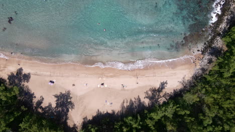 Top-view-on-paradise-Slaughterhouse-Beach-tame-wave-and-golden-sand,-Maui-Island