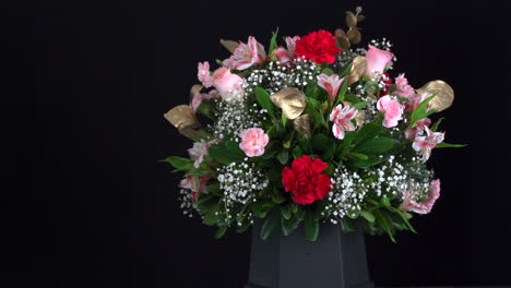 Floral-Carnation-arrangement-bouquet-slider-shot-black-background