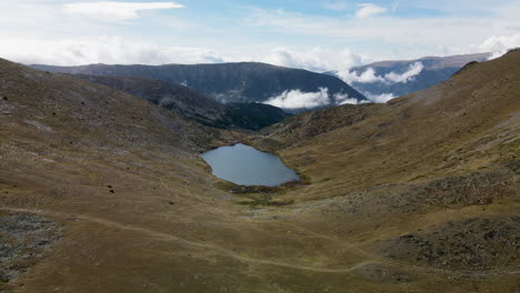 Aerial-approximation-to-a-little-lake-in-the-middle-of-a-valley-in-the-mountains-near-Puymorens