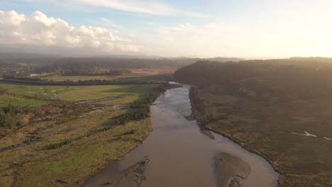 Aerial-View-Of-Sixes-River-at-Cape-Blanco-State-Park-With-Hughes-House-In-The-Background-In-Oregon-USA---Aerial-Drone-Shot