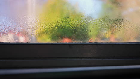 Dolly-right-shot-of-condensation-on-house-window