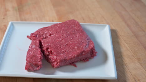 Static-shot-of-meat-or-vegan-meat-on-white-plate