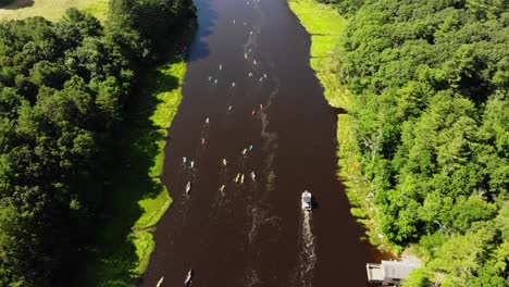 Boats-and-kayaks-are-paddling-and-sailing-on-River-in-a-River-Race-Competition---Aerial-View