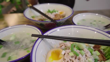 Traditional-Asian-Singaporean-noodles-soup-in-slow-motion-Meepok-with-egg-and-minced-meat-3