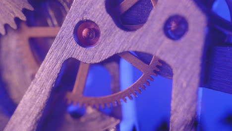 Cogwheel-And-Gears-Working-In-Mechanism-Of-Watch-In-Blue-Background