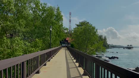Walking-At-Main-Entrance-Of-Pulau-Ubin-By-Boardwalk-And-Jetty-In-Singapore