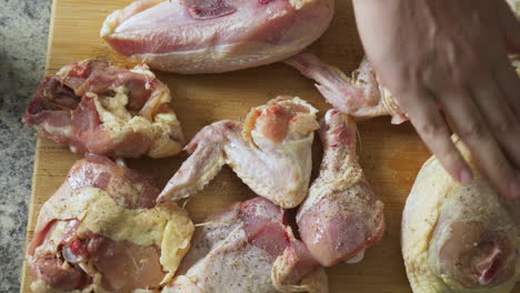 Rubbing-seasoning-on-raw-chicken