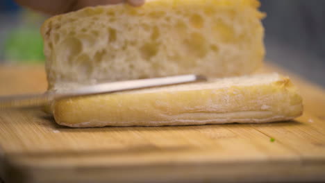 Cutting-and-opening-a-loaf-of-bread