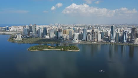 4K:-Sharjah-From-the-Top,-Aerial-view-of-Sharjah-city-and-Khalid-lake,-Al-Noor-Mosque-and-Island,-Travel-tourism-business-in-the-United-Arab-Emirates