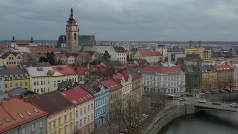 Aerial-View-Tracking-Toward-Gothic-Cathedral-Surrounded-by-Buildings-in-Hradec-Kralove,-Czech-Republic