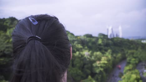 Woman-Wearing-Facemask-Admiring-The-Scenic-Nature-View-From-Henderson-Waves-Pedestrian-Bridge-In-Singapore-During-Pandemic