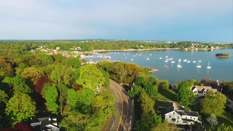 Amazing-vibrant-drone-footage-of-Hingham-Harbor,-a-seaside-community,-during-a-sunny-summer-morning